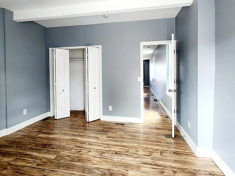 Bedroom, looking at closet and hallway to living room