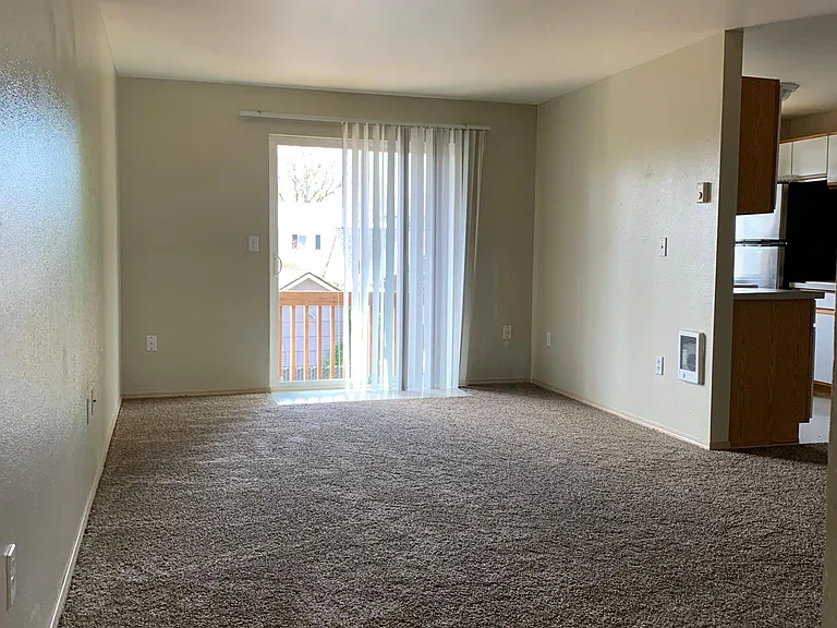 living room with kitchen & dining area to the right of the living room