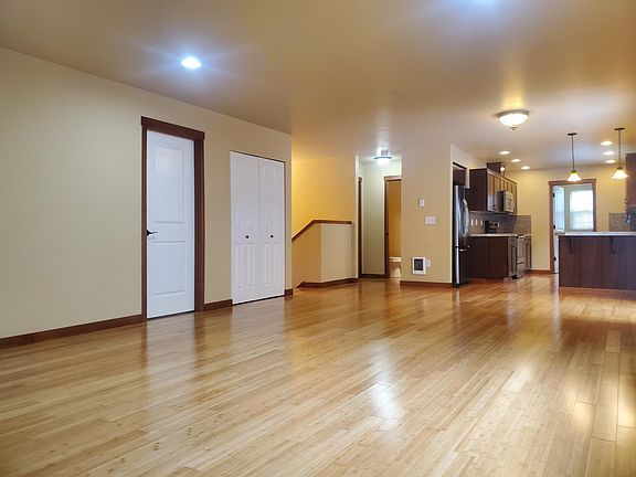Top Level Living Room View Towards Kitchen, Entry , Primary & Powder Room
