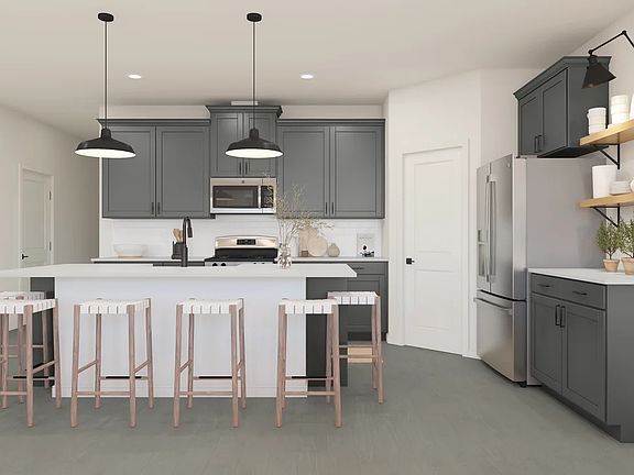 Kitchen with pendant lighting and floating shelves