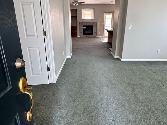 Front entry opens to living room to the right and office or additional bedroom to the left.