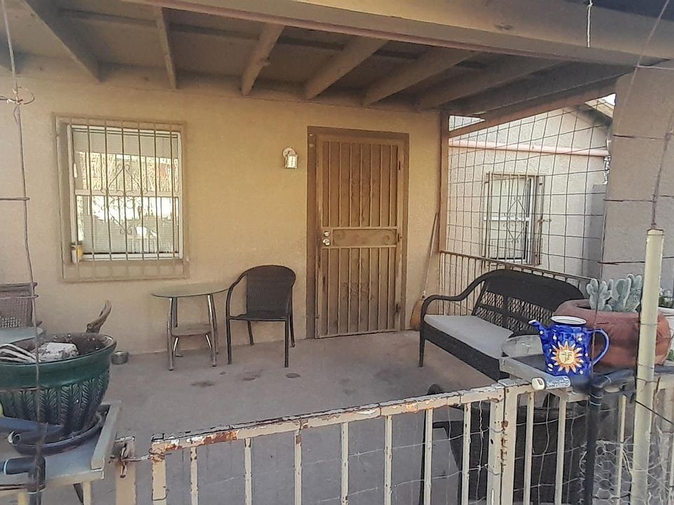 Covered patio with outdoor furniture.