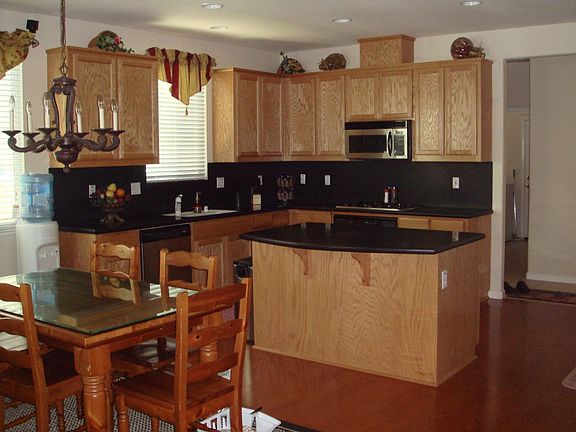 Kitchen with hardwood floors and corian countertops