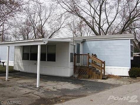 You'll Really Appreciate the Sunroom and Carport!