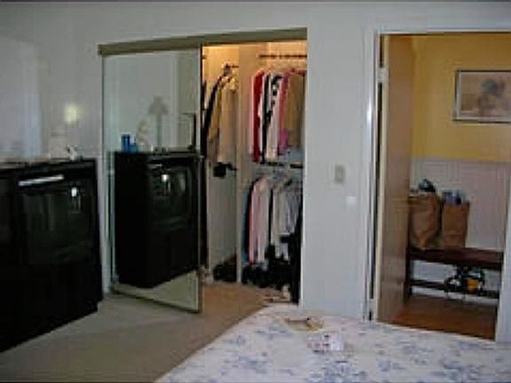 Bedroom next to the kitchen and bathroom includes a walk-in