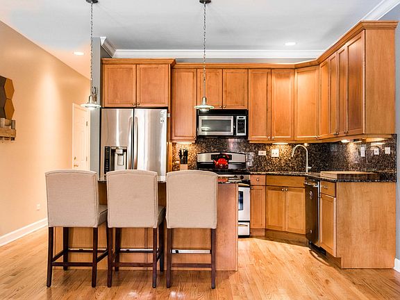 large granite island with plenty of kitchen storage