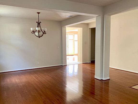 A light-filled doorway provides a connected yet private separation into additional first-floor living space.