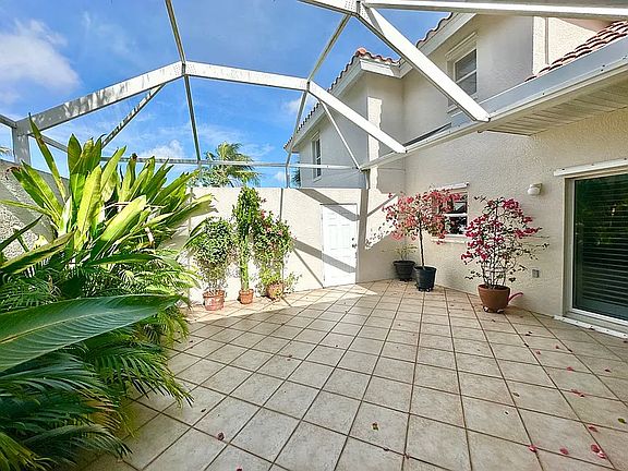 Your own private outdoor retreat_perfect for morning coffee, outdoor dining, entertaining, or enjoying the Florida sunshine year-round.