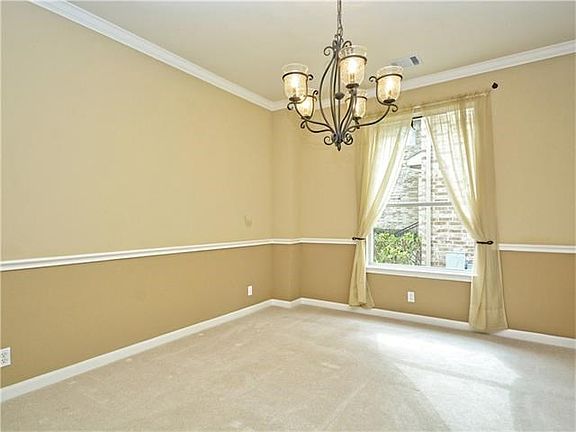The formal dining room is large enough for a large dining room set!