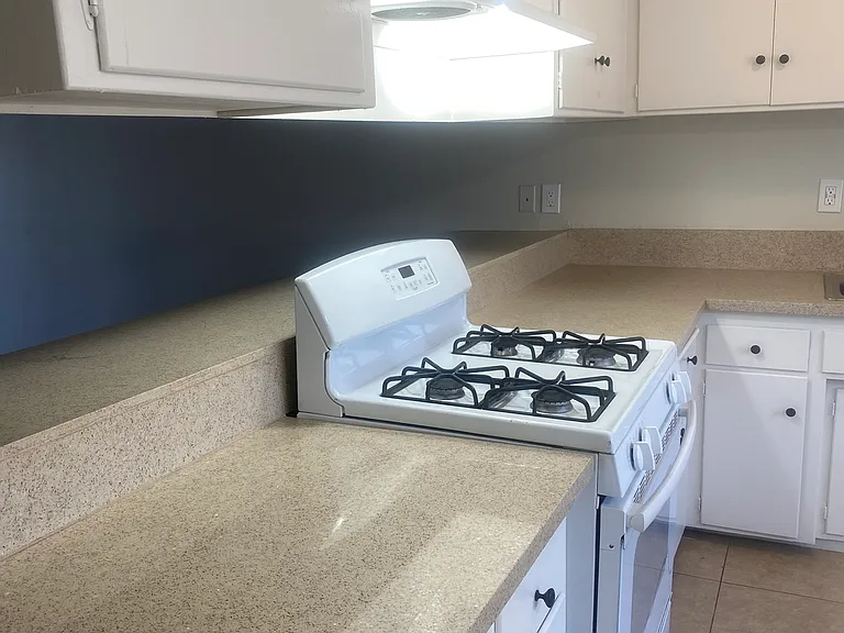 Lovely quartz kitchen counters and breakfast bar!