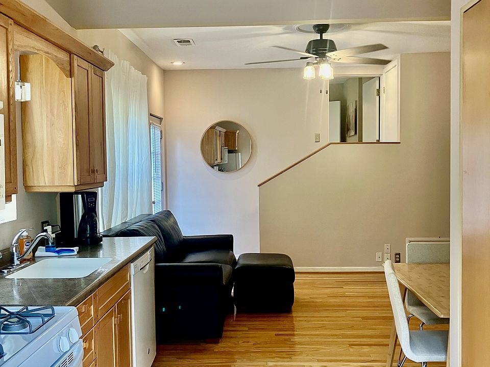 2nd bedroom set up as dedicated office space located up a few steps