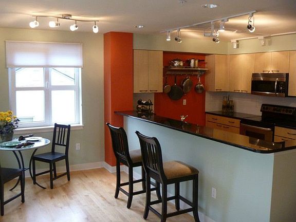 Kitchen also has hardwood floors and plenty of room for entertaining friends and family.
