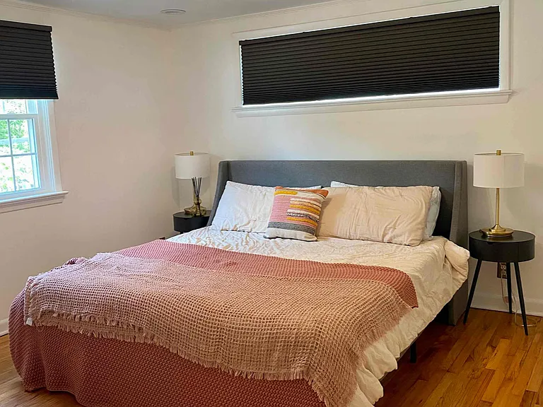 Primary King bedroom with closet and views of backyard