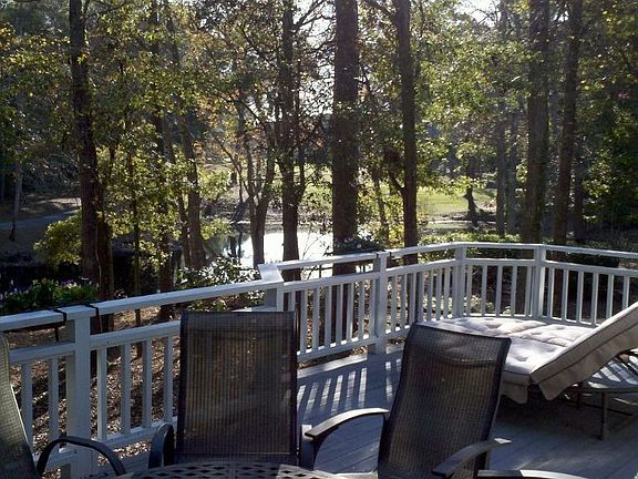 Upper deck overlooking pond, trees and golf course