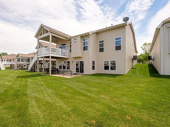Plenty of entertaining space- inside and outside. Covered Deck and Aggregate Patio with 9' Walkout Finished Lower Level