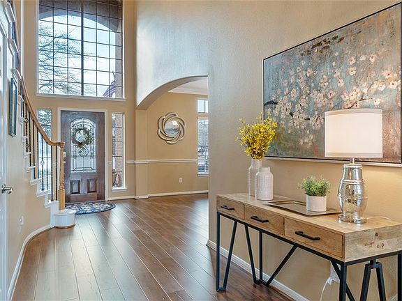 Another view of the entry with large windows making this home bright and welcoming.