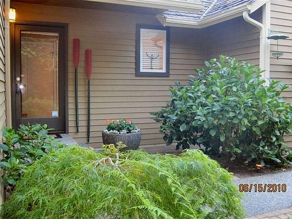 Welcome Home! 9439 37th Ave SW. Front door. You can't see them in this photo, but the Dahlia's are b