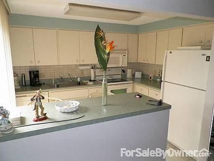 Living Room
						:
						The living room is furnished and has access to the lake, pool and screened lanai