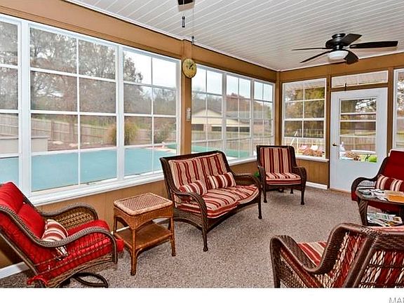 Talk about a room that you will want to spend all of your time in.  Three Season Room - the windows are amazing - they fold down for as much breeze as you want.