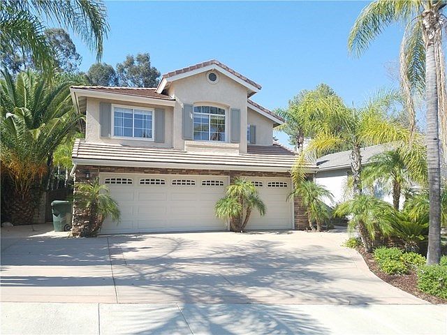 Welcome home! Spacious lot with RV access and 3 car garage.