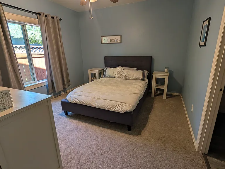 Master bedroom with queen bed. Door to right leads to en-suite bathroom and walk-in closet