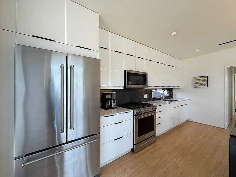 This kitchen is equipped with a gas stove and KitchenAid stainless appliances.