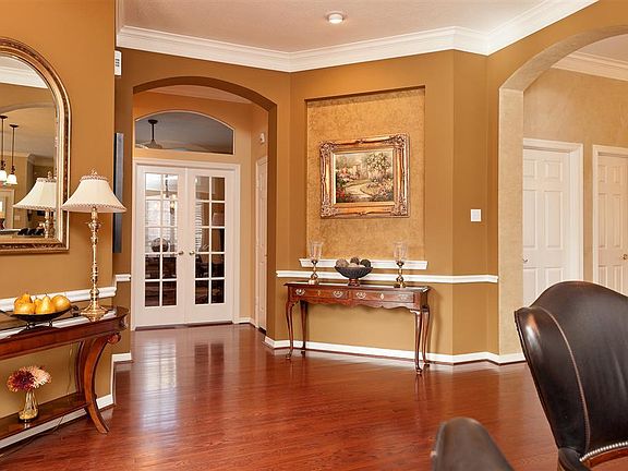 View from the front door, to the right is the formal dining room and beyond are the french doors to 