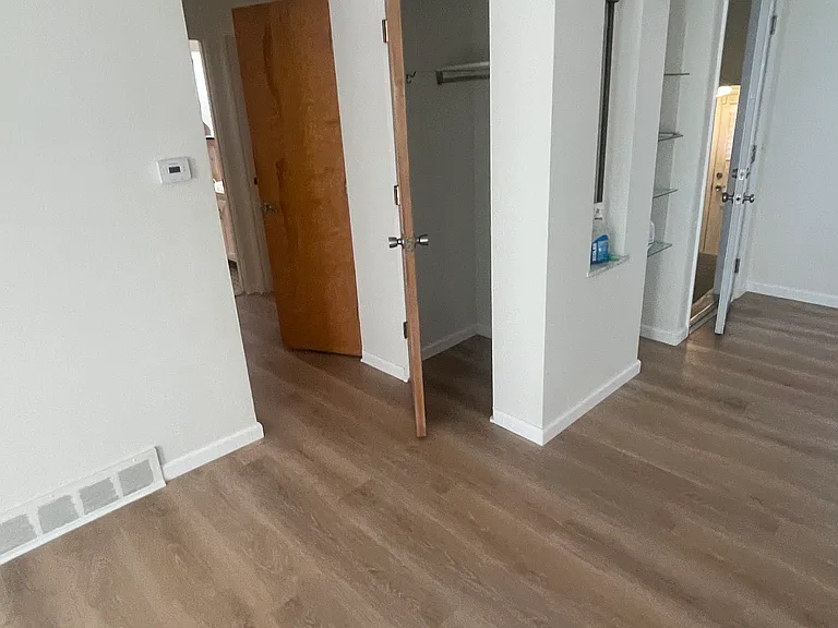 living room closet next to the hallway