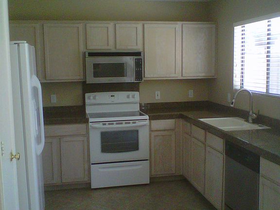 Kitchen, Brand New White Microwave being installed