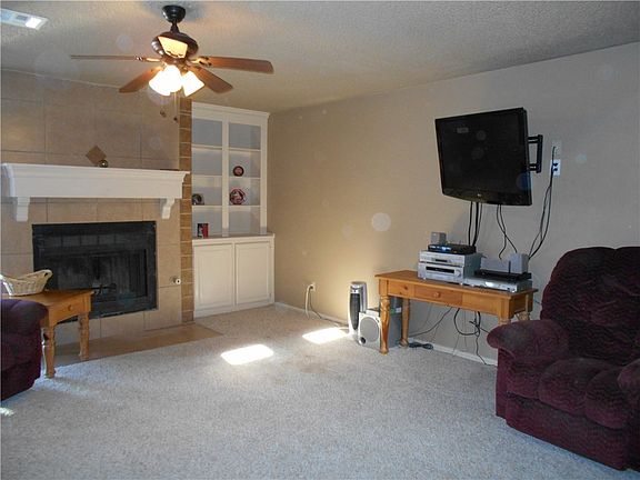 The fireplace is the focal point of the room.