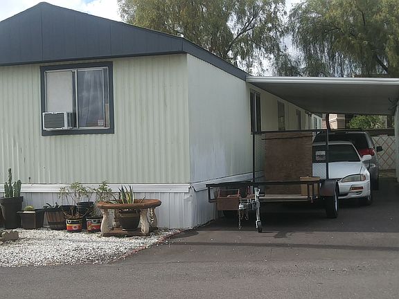 Covered Car port fits 3 cars