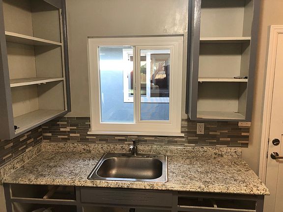 Cabinet doors and drawers are in the process of being refinished and should be completed shortly. Apologies for the incomplete picture here.