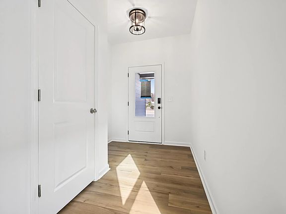 Foyer featuring the AW Collection R Harmony - A refined welcome with soft light and style.