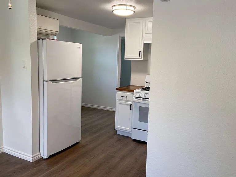 View to dining nook. New refrigerator