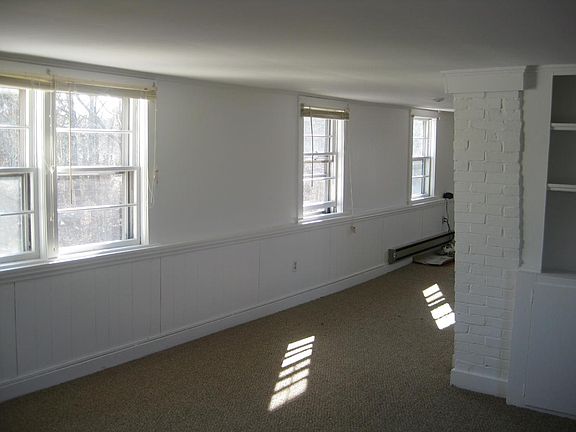 Between the kitchen and living areas.