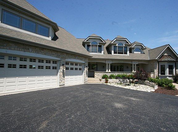 3-Car Attached Garage with Deep Circle Drive, and Covered Front Porch