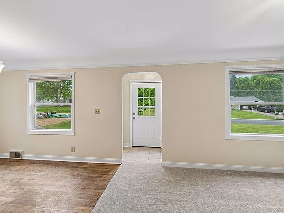 Bright open front rooms - living room and dining room.