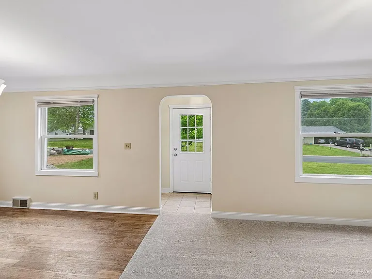 Bright open front rooms - living room and dining room.