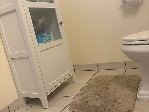 Vanity piece provides extra storage in bathroom.