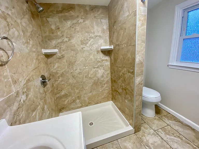 first floor full bathroom, totally tiled, window, LED lights