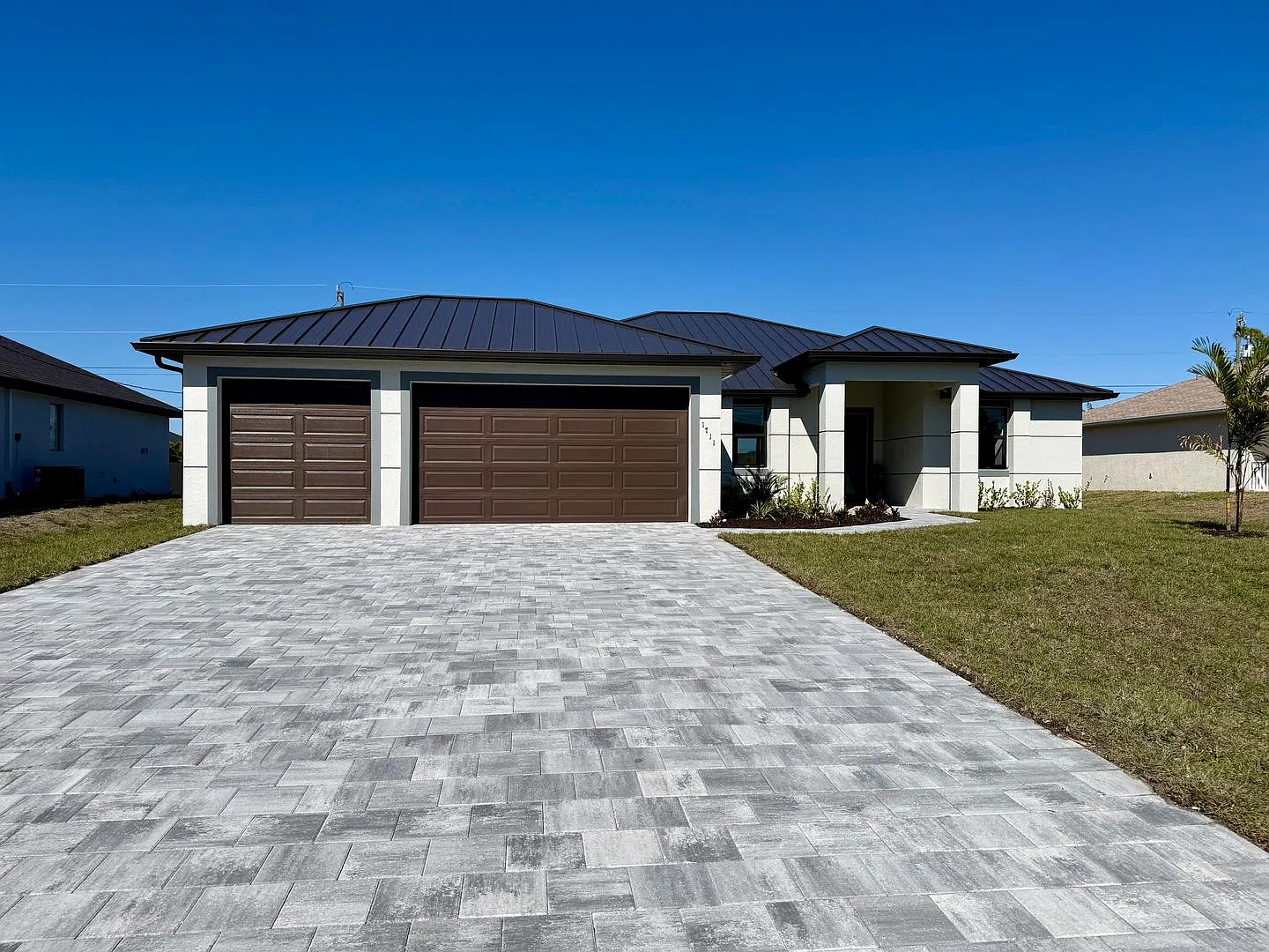 Brand-New Waterfront Luxury in Cape Coral | Heated Pool, Spa, Outdoor Kitchen & 3-Car Garage — Photo 1