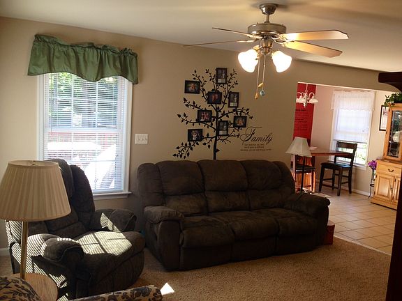 Living room w/ dining in background