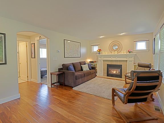 Front living area on main floor with gas fireplace