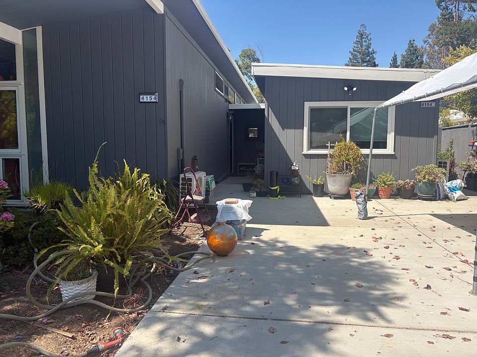 Front of the ADU with big window (with pull-down, pull-up cellular shades for privacy)
