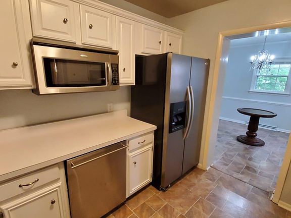 Updated kitchen with stainless steel appliances and plenty of storage and entrance to dining room.