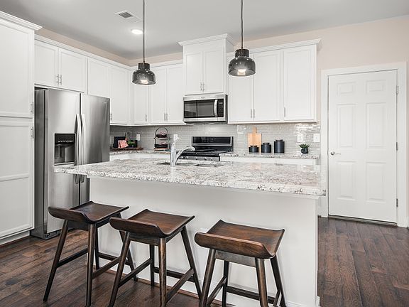 Model Representation - Stunning Kitchen with Stainless Steel Appliances