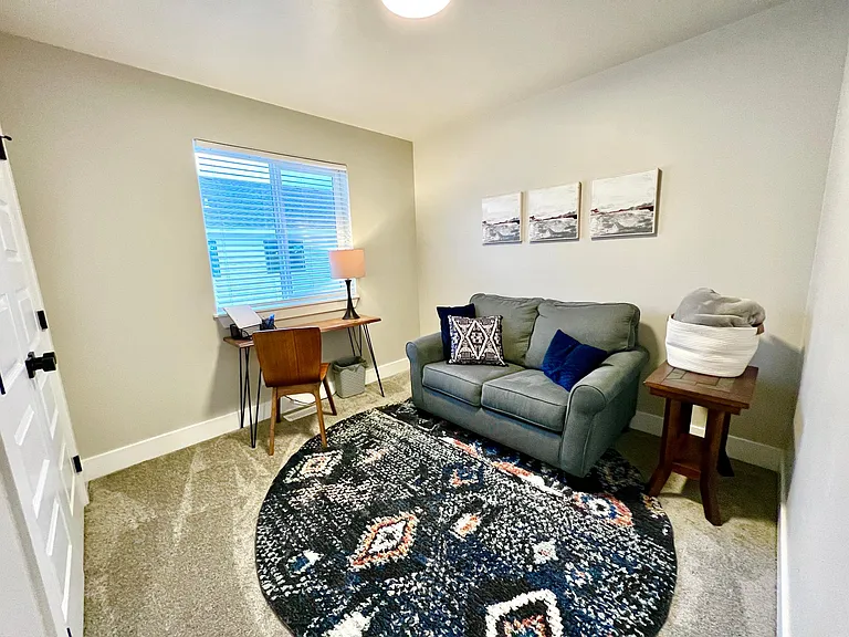 Loveseat pulls out to twin bed.