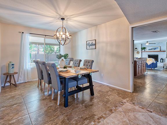 Dedicated dining room with entry into kitchen area (table will not be included in furnishings).