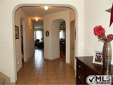 Two story entry way with view towards the kitchen & living area