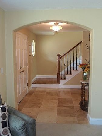 Travertine / hardwood floor